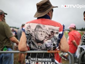 Supporters of Donald Trump line up to attend a