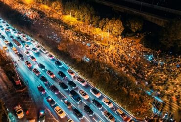 Aerial photo shows college students riding bicycles on the Zhengkai Road in Zhengzhou