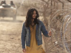 al-Masih putting his hand against a barb wire fence in Messiah