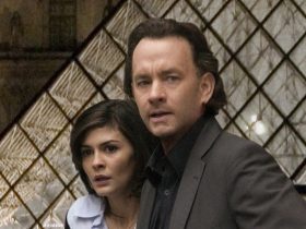 Robert Langdon and Sophie Neveu looking tense in front of the Louvre