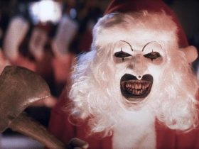 Art the Clown in a Santa suit with an axe, from Terrifier 3.