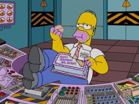 Homer eating a birthday cake for Mr. Burns at his desk in The Simpsons