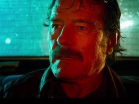 Bryan Cranston's Robert Mazur looking nervous in the back of a car at night in The Infiltrators