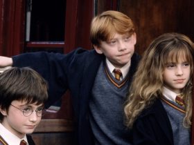 Harry, Ron, and Hermione on the Hogwarts Express in Harry Potter and the Sorcerer's Stone