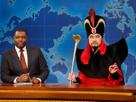 Bowen Yang as Jafar from Aladdin on Saturday Night Live's weekend update desk.